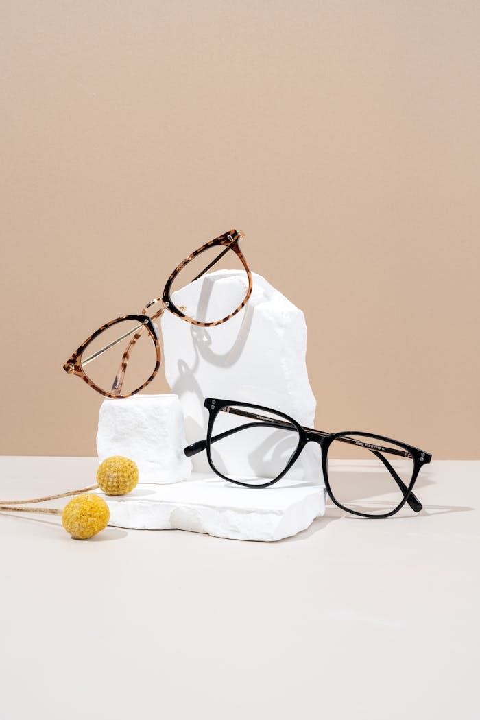 Stylish glasses set against a minimalist studio backdrop highlighting modern eyewear design.